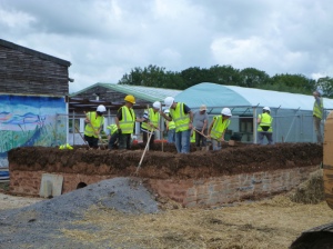 Building the cob walls. Photo by Avalon Marshes Centre.